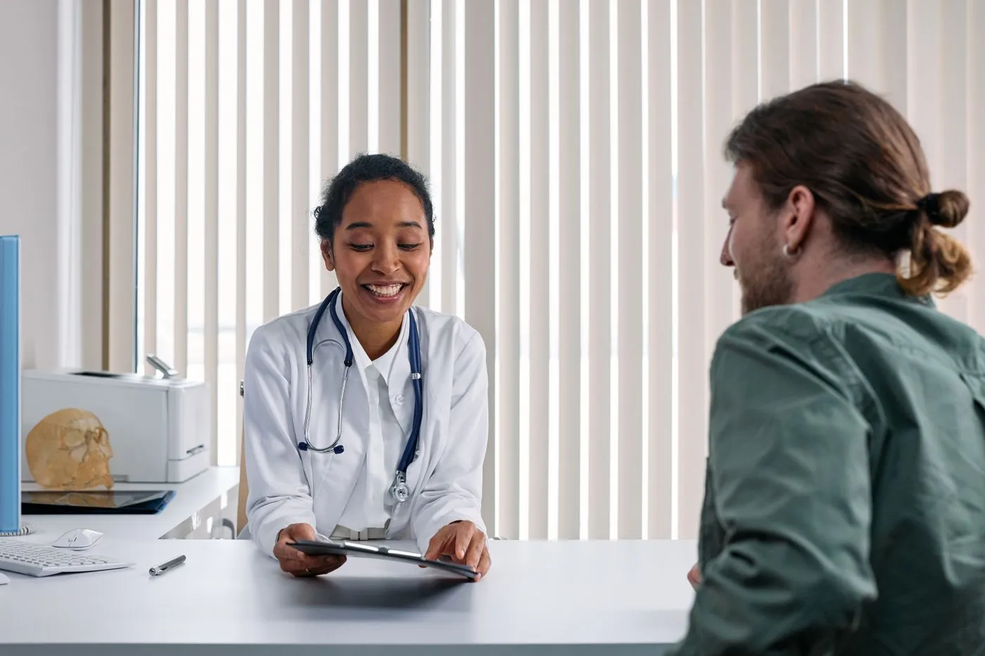 Diabetes care and education specialist reviewing a glucose management plan with a patient