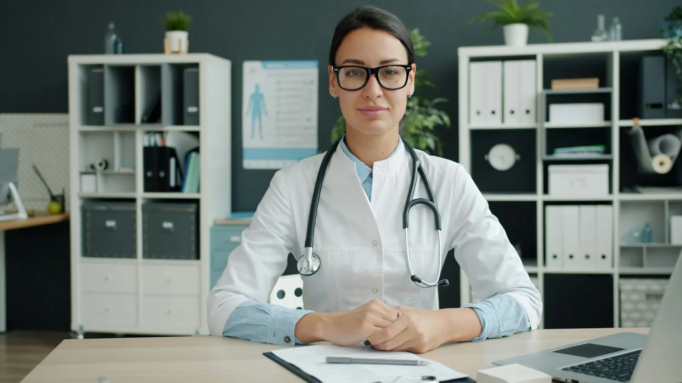 Endocrinologist reviewing patient notes at her desk